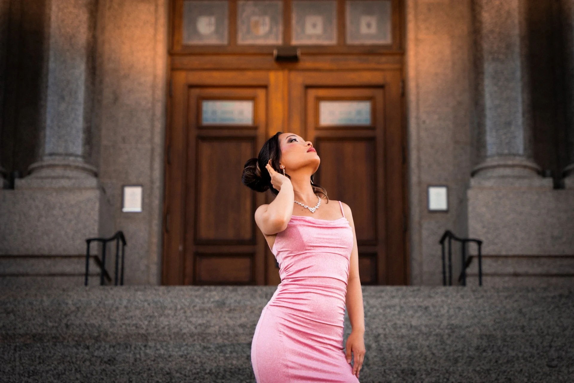 Elegant portrait session on the steps of a historic building in Rochester, MN